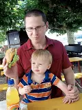 Matthew Guenette with a small boy on his lap