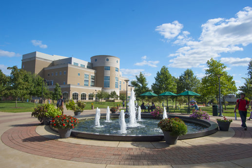 Exterior view of Rice Library from in front of the Quad fountain in spring