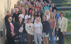 USI and Germany students pose for photo on steps