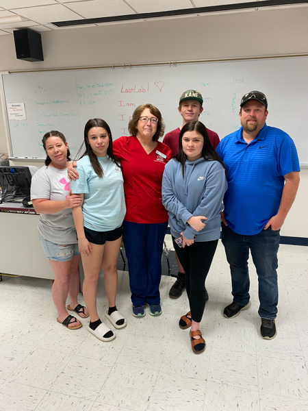 Susan with photo with parents and children who were in car accident