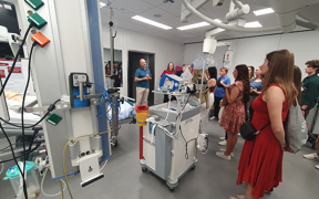 Students listen to guide during hospital tour