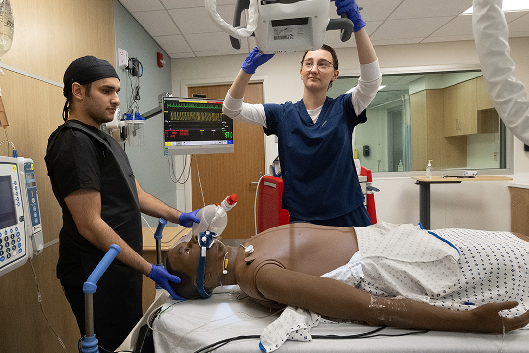 Respiratory therapy and radiology student X-ray a practice patient in the simulation center