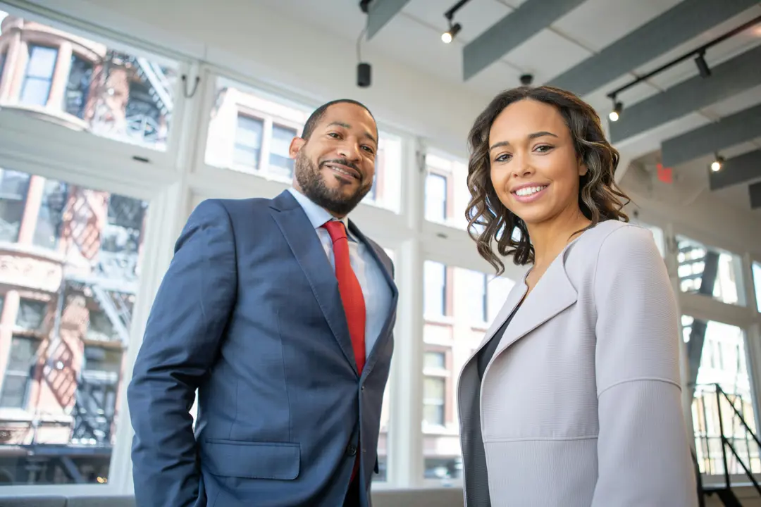 Stock photograph of a man and a woman in business suits
