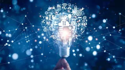 Hand holding an illuminated lightbulb with different technology logos emanating from it