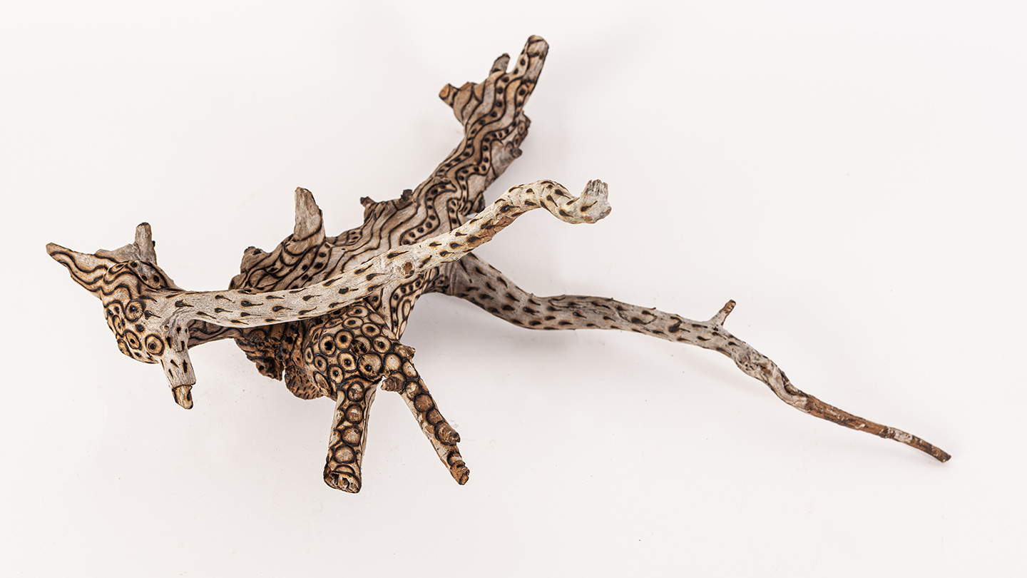 tattooed wood art piece