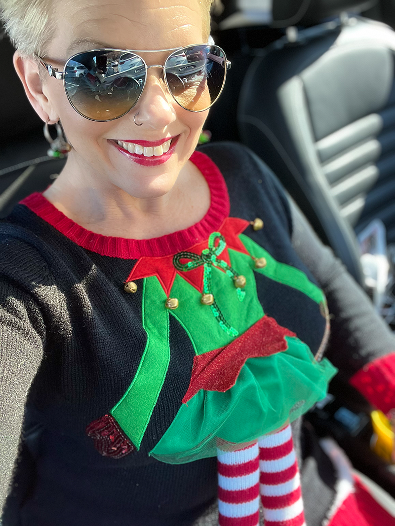 Woman wearing a ugly holiday sweater