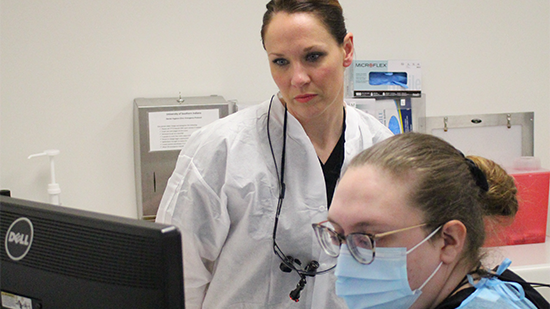 Phot of a Dental instructor with student