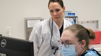 Phot of a Dental instructor with student