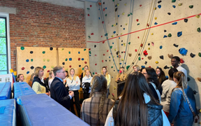 Students standing in front of a rock wall in Germany