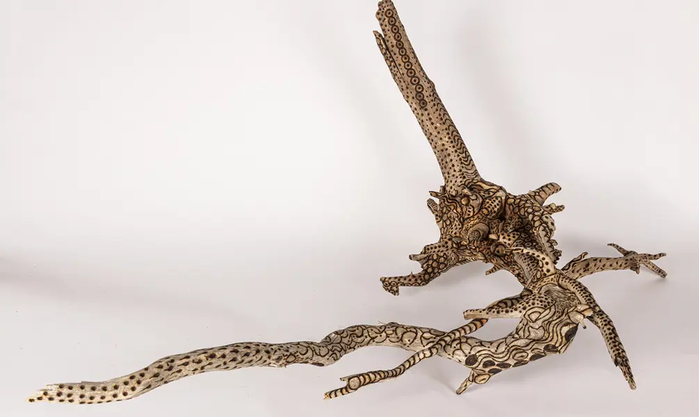 tattooed wood art piece