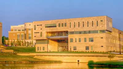 Exterior view of the Business and Engineering Center from the west bank of Reflection Lake