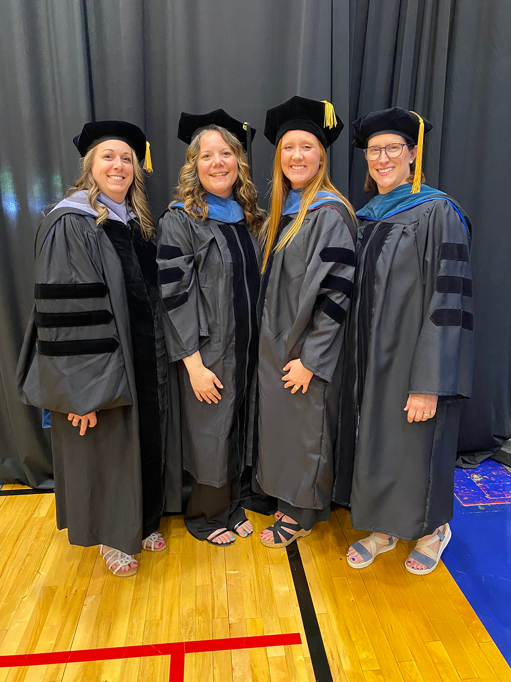 Occupational therapy faculty in commencement caps and gowns