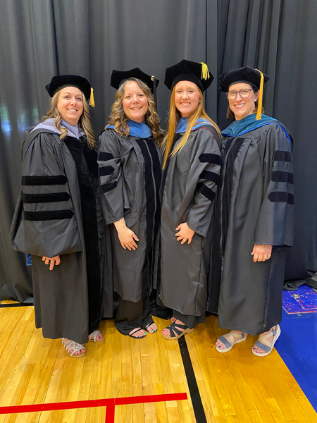 Occupational therapy faculty in commencement caps and gowns