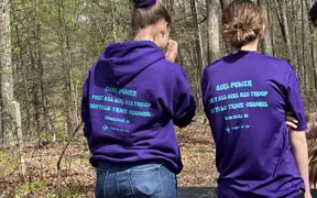 A Girl Scout Troop, also a Scouting Troop pause after installing a bench on the Bent Twig Trail