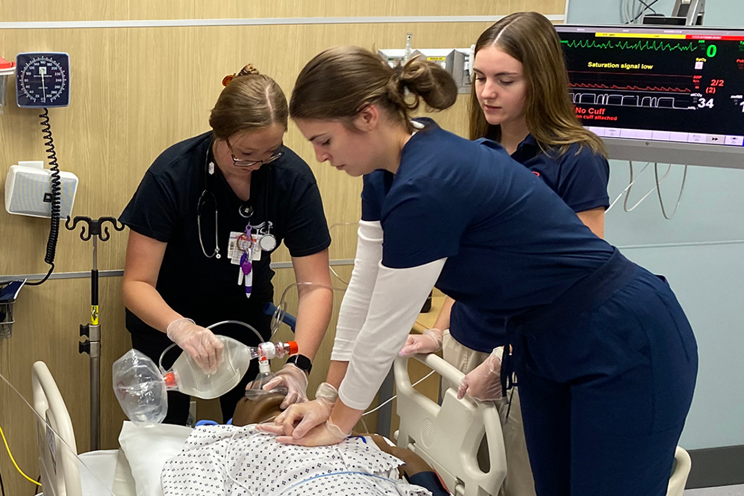 Respiratory Therapy students work a code blue on a practice patient in the simulation center