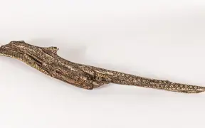 tattooed wood art piece