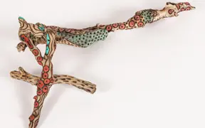 tattooed wood art piece