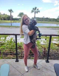 Meggie holding her dog