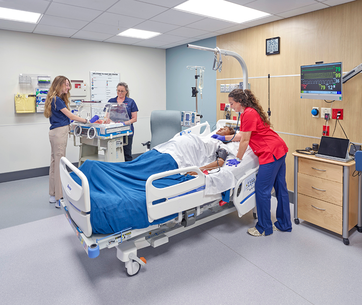 nursing students in the labor and delivery room in clinical simulation center