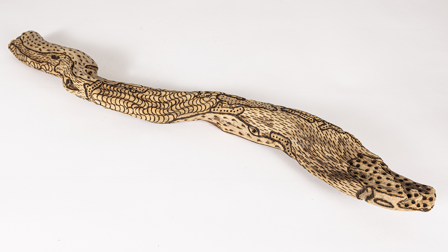 tattooed wood art piece