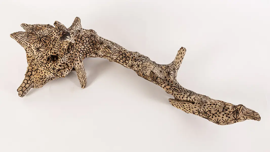 tattooed wood art piece