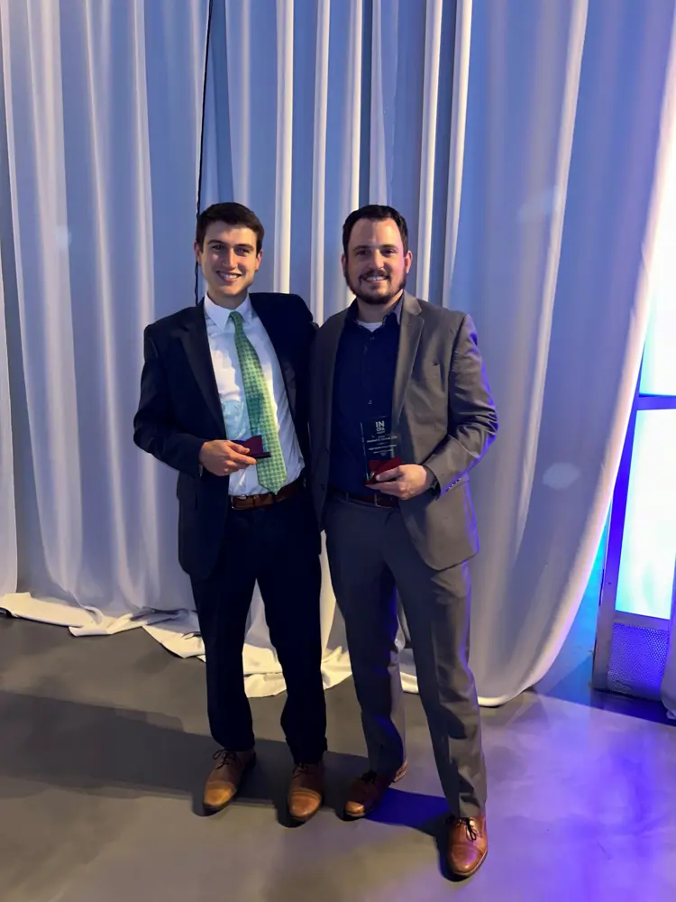 Parker Collignon and Marshall Gruber pose with awards from the Indiana CPA Society.