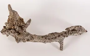 tattooed wood art piece
