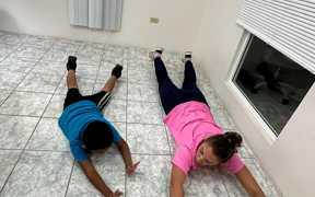 OT student stretching with student on the floor