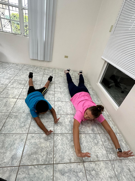 OT student stretching with student on the floor