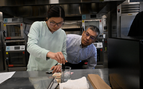 Faculty member and student during a food science class