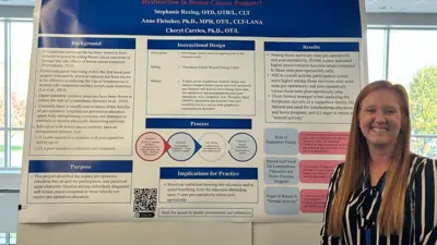 OT faculty in front of her poster