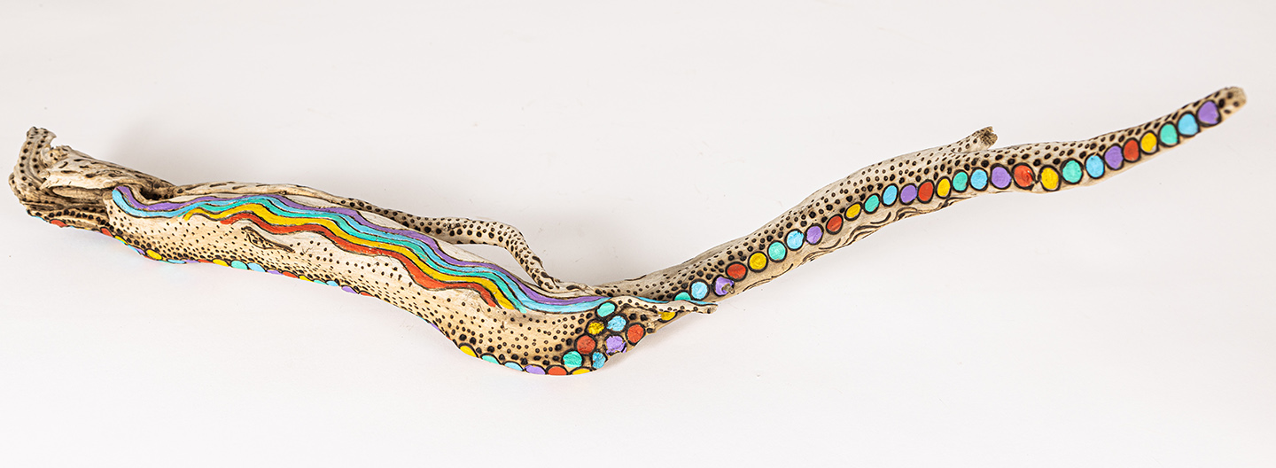 tattooed wood art piece