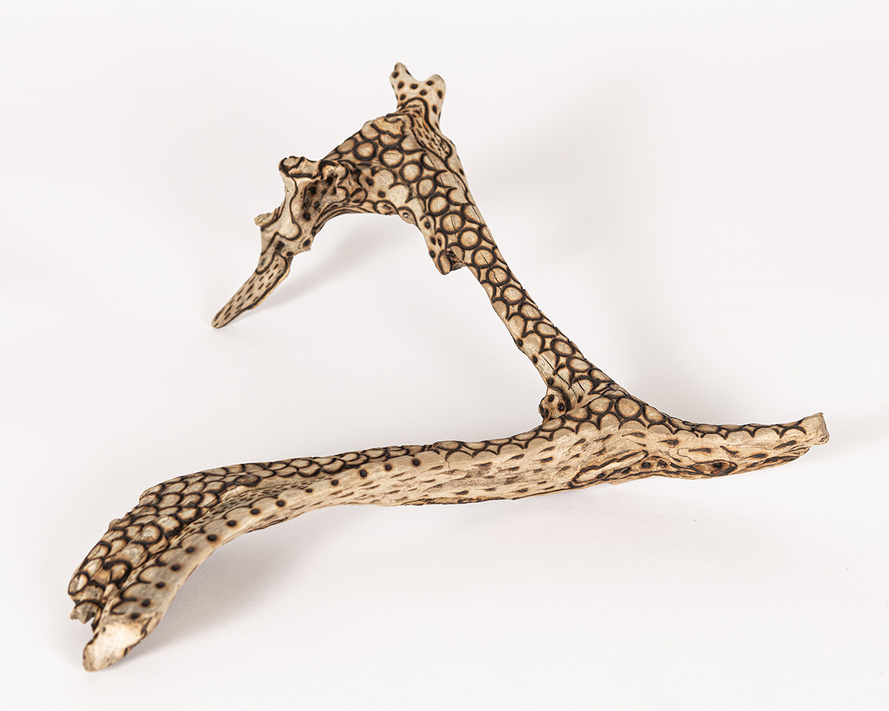 tattooed wood art piece