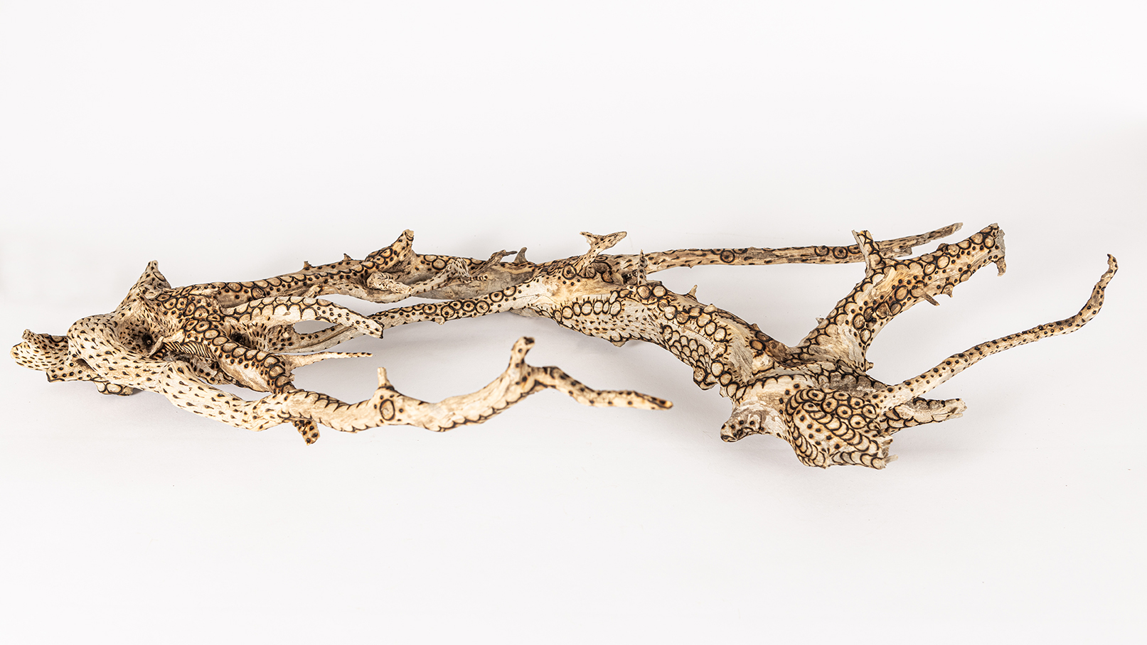 tattooed wood art piece