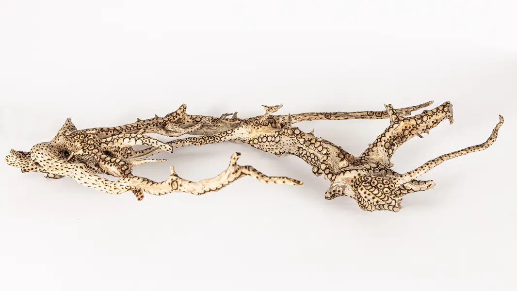 tattooed wood art piece
