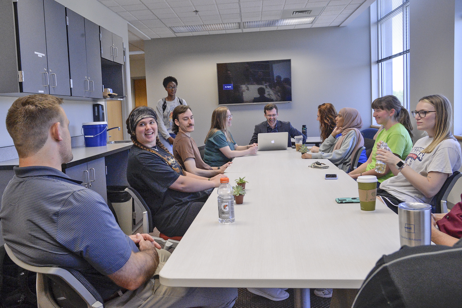 USI psychology students learn from their professor in the research lab