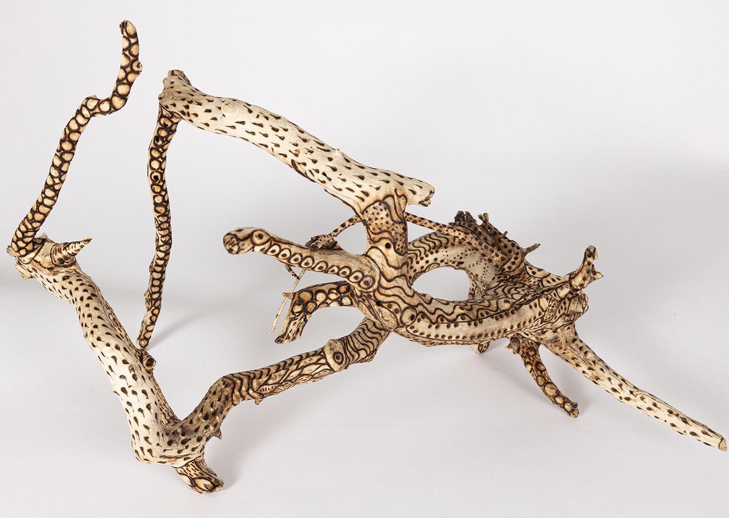 tattooed wood art piece