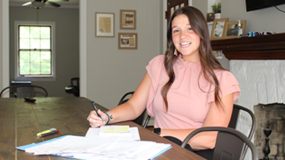 Student sitting at a desk at a professional office