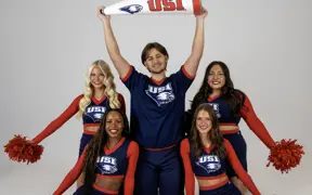 Members of USI's Cheer Team posing together for their media day photos. 