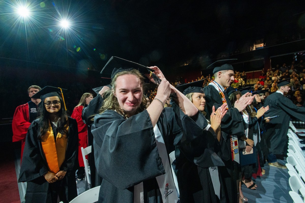 A student turns her tassel at a Commencement Ceremony in Liberty Arena, Home of the Screaming Eagles.